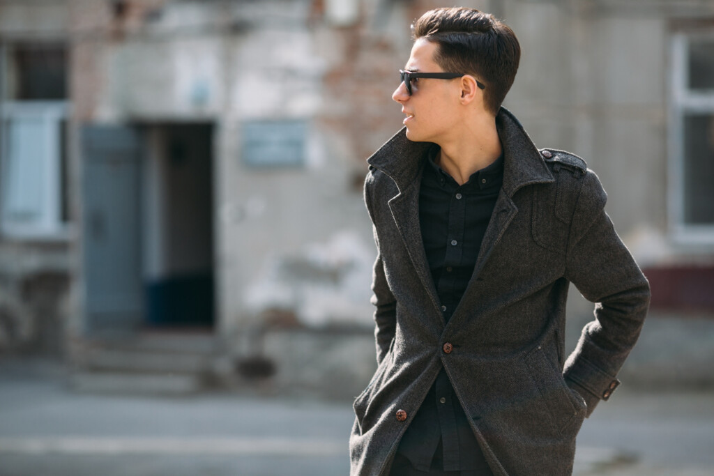 man-posing-in-raincoat-and-sunglasses